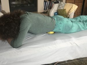 How to use a small ball to eliminate low back pain